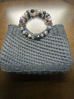 Many Moods of Poppie Jones Beaded Handle Black Woven Clutch Handbag